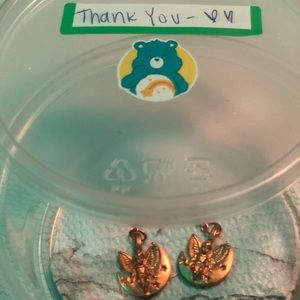 Half inch copper angel sitting on moon w/ stars.